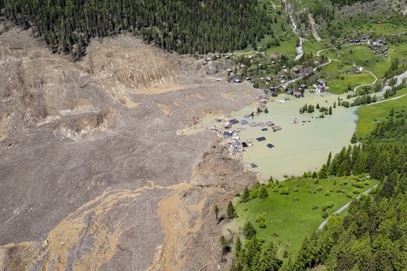 A aerial view captured one day after a massive avalanche, triggered by the collapse of the Birch Glacier, shows the destruction it caused as it swept down to the valley floor and demolishing the villa ...