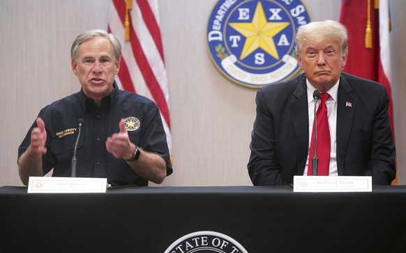 Texas Gov. Greg Abbott, left, speaks at a border security briefing as former President Donald Trump listens at the Texas DPS Weslaco Regional Office, Wednesday, June 30, 2021, in Weslaco, Texas. (Joel ...