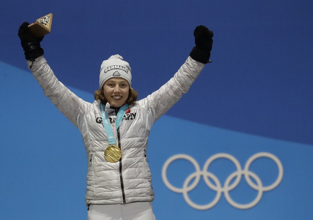 FILE -Women's 7.5km biathlon sprint gold medalist Laura Dahlmeier, of Germany, celebrates during the medals ceremony at the 2018 Winter Olympics in Pyeongchang, South Korea, Feb. 11, 2018. (AP Ph ...