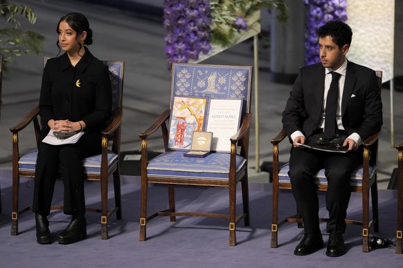 Kiana Rahmani, left, and Ali Rahmani attend the awarding of the Nobel Peace Prize for 2023 in Oslo City Hall, Oslo, Norway, Sunday, Dec. 10, 2023. The children of imprisoned Iranian activist Narges Mo ...