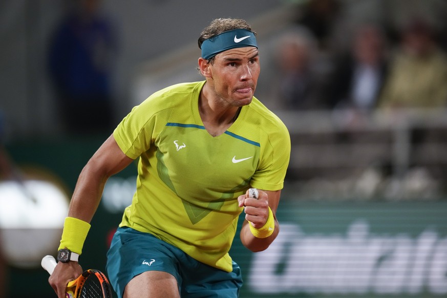 Spain&#039;s Rafael Nadal clenches his fist after scoring a point against Serbia&#039;s Novak Djokovic during their quarterfinal match at the French Open tennis tournament in Roland Garros stadium in  ...