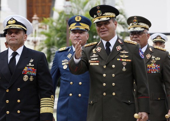 FILE - In this Aug. 8, 2017 file photo, Venezuela&#039;s Defense Minister Vladimir Padrino Lopez, center right, accompanied by a group of military commanders, arrives at the National Assembly building ...