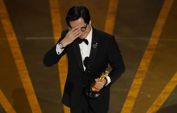 Ke Huy Quan accepts the award for best performance by an actor in a supporting role for &quot;Everything Everywhere All at Once&quot; at the Oscars on Sunday, March 12, 2023, at the Dolby Theatre in L ...