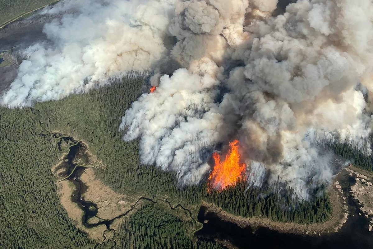 Smoke rises from the Kiskatinaw River wildfire (G70422) during a planned ignition operation, south of Dawson Creek, British Columbia, Canada June 7, 2025. BC Wildfire/Handout via REUTERS. THIS IMAGE H ...