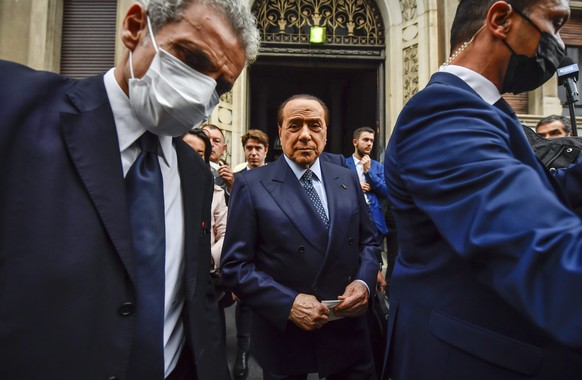 FILE - In this Sunday, Oct. 3, 2021 file photo, Silvio Berlusconi leaves a polling station in Milan, Italy. Lawyers for Silvio Berlusconi, the former Italian premier, say he has been acquitted by a co ...