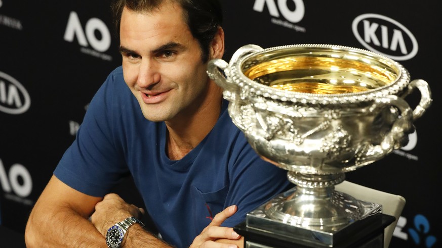 Switzerland&#039;s Roger Federer answers questions at a press conference after defeating Spain&#039;s Rafael Nadal in the men&#039;s singles final at the Australian Open tennis championships in Melbou ...