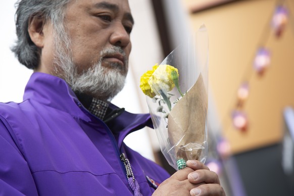 epa10939892 Lee Jong-min, President of the &#039;10.29 Itaewon Disaster Bereaved Families&#039; group and father of late Lee Ju-young, prays at a memorial at the site of the Itaewon tragedy in Seoul,  ...