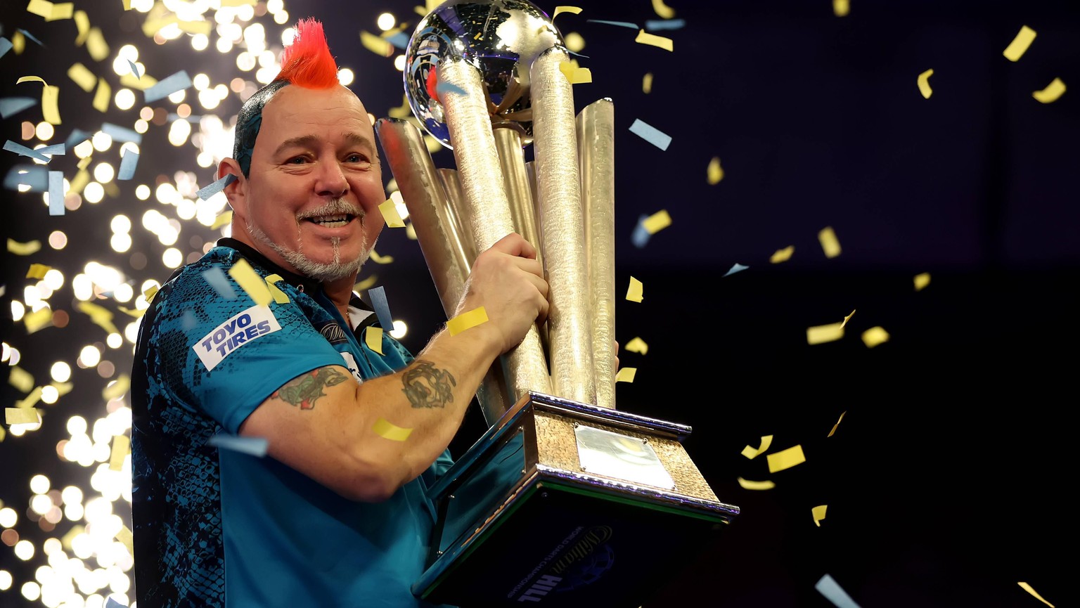 IMAGO / Action Plus

3rd January 2022: Alexandra Palace, London, England: The William Hill World Darts Tournament final between Peter Wright and Michael Smith; Peter Wright celebrates with the PDC Wor ...