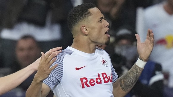 Salzburg&#039;s Noah Okafor celebrates after scoring his side&#039;s third goal during the Champions League group G soccer match between Salzburg and VfL Wolfsburg, at the Salzburg stadium, in Salzbur ...