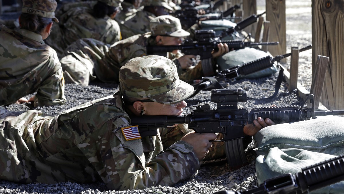In this photo taken Wednesday, Aug. 17, 2016 U.S. Army Private Austin Lewis fires his M-4 weapon while participating in live-fire marksmanship training at Fort Jackson, S.C. While some of the Army ...