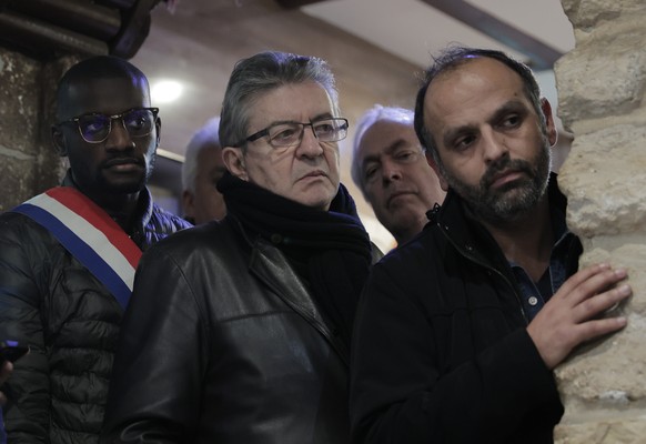 Far-left leader Jean-Luc Melanchon attends a media conference near the crime scene where the shooting took place in Paris, Friday, Dec. 24, 2022. A shooting targeting a Kurdish cultural center in Pari ...