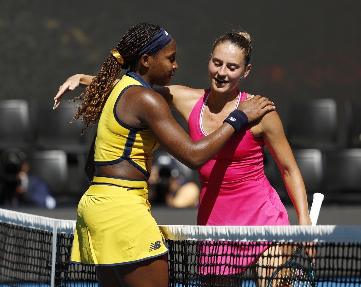 epa11097598 Coco Gauff (L) of the USA and Marta Kostyuk (R) of Ukraine greet each other at the net after the women's singles quarterfinals match at the Australian Open tennis tournament in Melbou ...