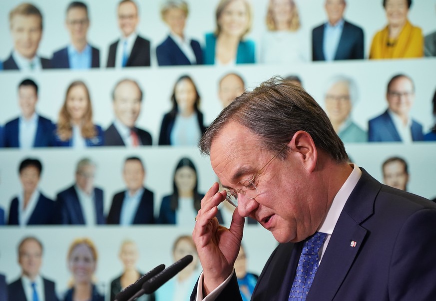 epa08958245 New party leader of the German Christian Democrats (CDU) Armin Laschet speaks to supporters via live-stream after a count of ballots confirmed his election at CDU headquarters in Berlin, G ...