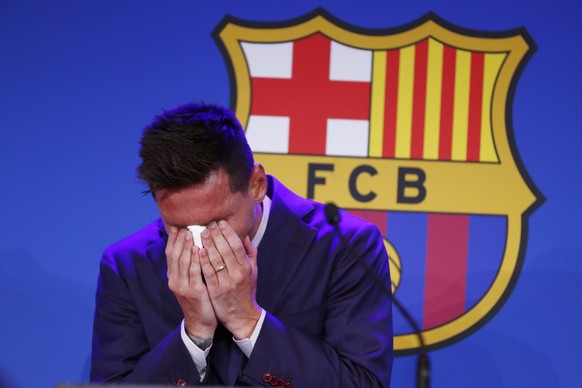 Lionel Messi cries at the start of a press conference at the Camp Nou stadium in Barcelona, Spain, Sunday, Aug. 8, 2021. FC Barcelona had previously announced the negotiations with Lionel Messi had en ...
