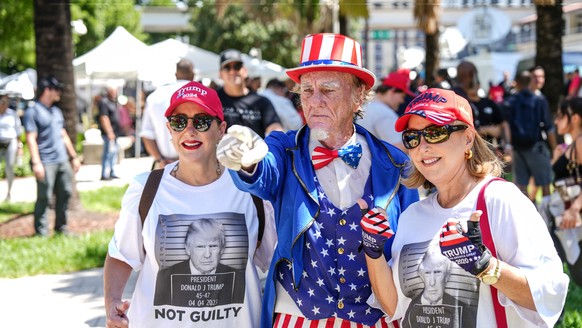 epa10689013 Crowds gather at the Wilkie D. Ferguson United States Courthouse where former President Donald Trump is scheduled to surrender to federal authorities in Miami, Florida, USA, 13 June 2023.  ...