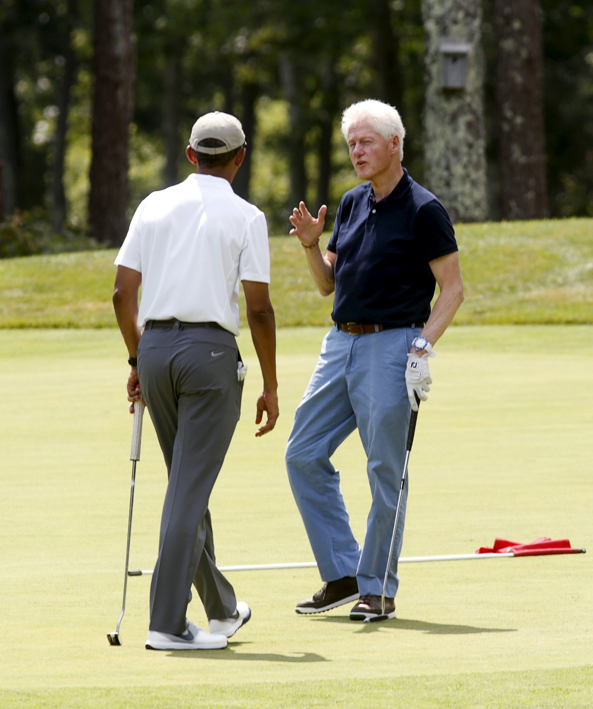U.S. President Barack Obama and former President Bill Clinton play a round of golf together at Farm Neck Golf Club on Martha's Vineyard in Massachusetts, August 15, 2015. Obama and former Preside ...