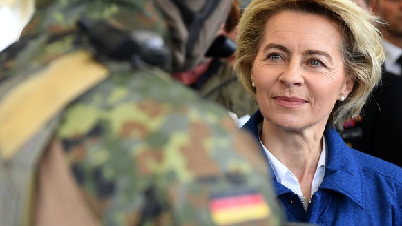 epa05940560 (FILE) - A file photograph showing German Defence Minister Ursula von der Leyen (R) listens to a soldier of the German special naval forces (L) during a visit of a corvette of the German N ...