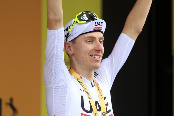 epa11487905 Slovenian rider Tadej Pogacar of UAE Team Emirates celebrates on the podium after winning the 19th stage of the 2024 Tour de France cycling race over 144km from Embrun to Isola 2000, Franc ...