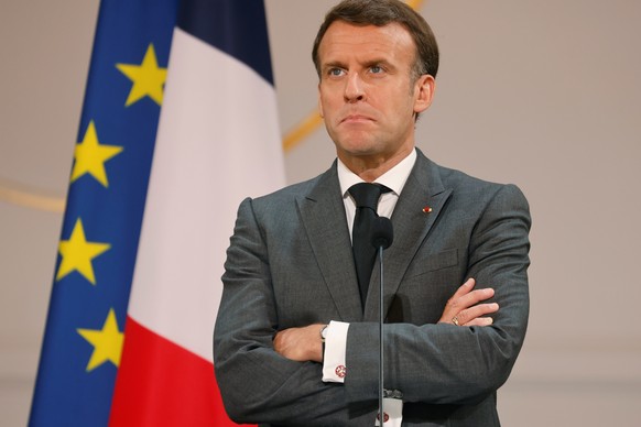 epa09171384 French President Emmanuel Macron delivers a speech during the traditional Lily of the valley ceremony at the Elysee palace, in Paris, France, 01 May 2021. EPA/LUDOVIC MARIN / POOL MAXPPP O ...