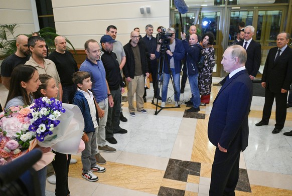 epa11517323 Russian President Vladimir Putin meets Russian citizens released after the Russian-US prisoner swap in Turkiye at Vnukovo International Airport in Moscow, Russia, 01 August 2024. On August ...