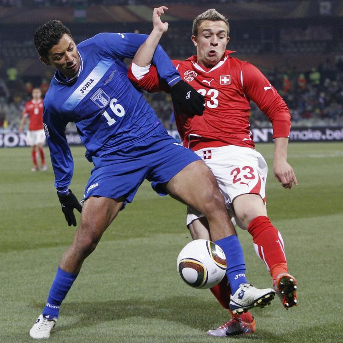Switzerland's Xherdan Shaqiri, right, fights for the ball with Honduras' Mauricio Sabillon, left, during Group H's 2010 FIFA soccer World Cup preliminary round match between Switzerland ...