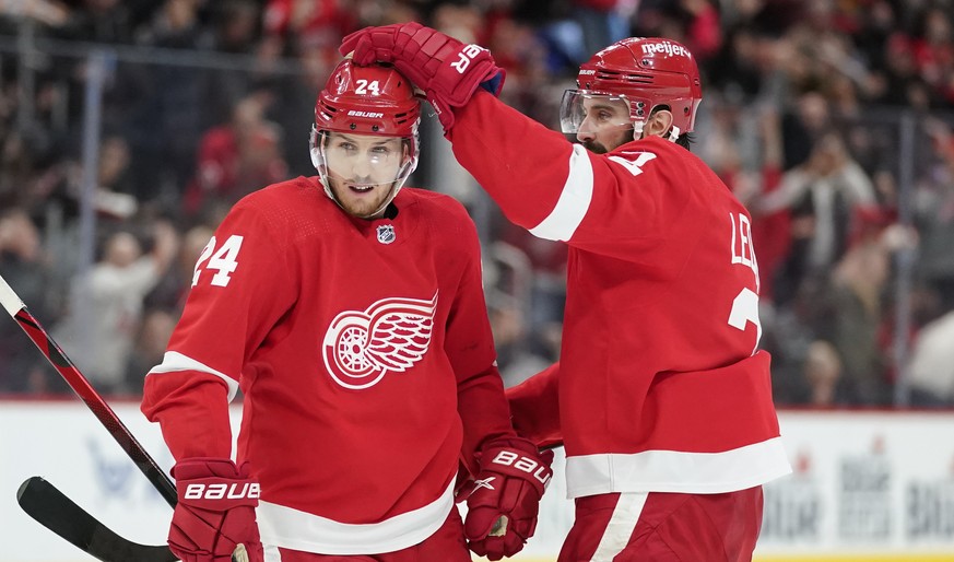 Detroit Red Wings center Pius Suter (24) celebrates his goal with Nick Leddy (2) in the second period of an NHL hockey game against the Chicago Blackhawks Wednesday, Jan. 26, 2022, in Detroit. (AP Pho ...