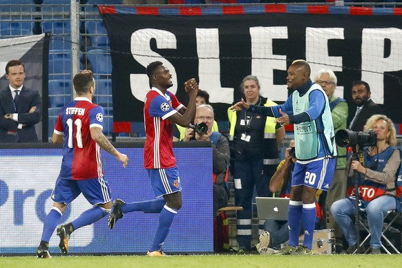 Basel&#039;s Dimitri Oberlin, center, celebrates after scoring the 4-0 during an UEFA Champions League Group stage Group A matchday 2 soccer match between Switzerland&#039;s FC Basel 1893 and Portugal ...