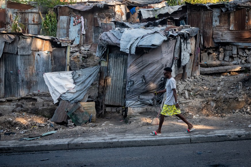 epa10401871 A man walks in downtown Port-au-Prince, Haiti, 12 January 2023. Haiti marks the 13th anniversary of the earthquake that shook the country on 12 January 2010. EPA/Johnson Sabin