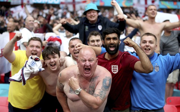 England fans celebrate after the Euro 2020 round of 16 soccer match between England and Germany at Wembley Stadium, in London, Tuesday June 29, 2021. (Nick Potts/PA via AP)