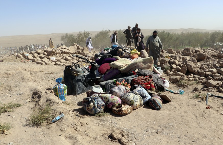 Belongings are seen on the ground after an earthquake in Zenda Jan district in Herat province, of western Afghanistan, Sunday, Oct. 8, 2023. Powerful earthquakes killed at least 2,000 people in wester ...