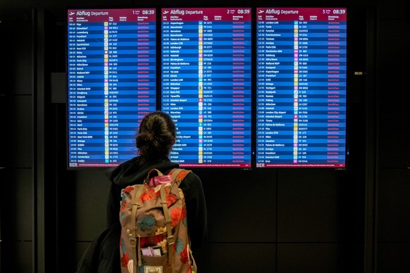 A passenger looks at the monitor displaying canceled flights at the Berlin-Brandenburg airport, Germany, Monday, March 10, 2025. (AP Photo/Ebrahim Noroozi)
Germany Airport Strike
