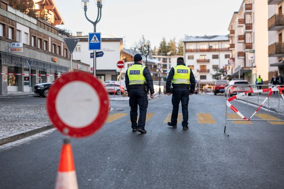 Police officers inspect the area where a fire broke out at the Le Constellation bar and lounge leaving people dead and injured, during New Years celebration, in Crans-Montana, Swiss Alps, Switzerland ...