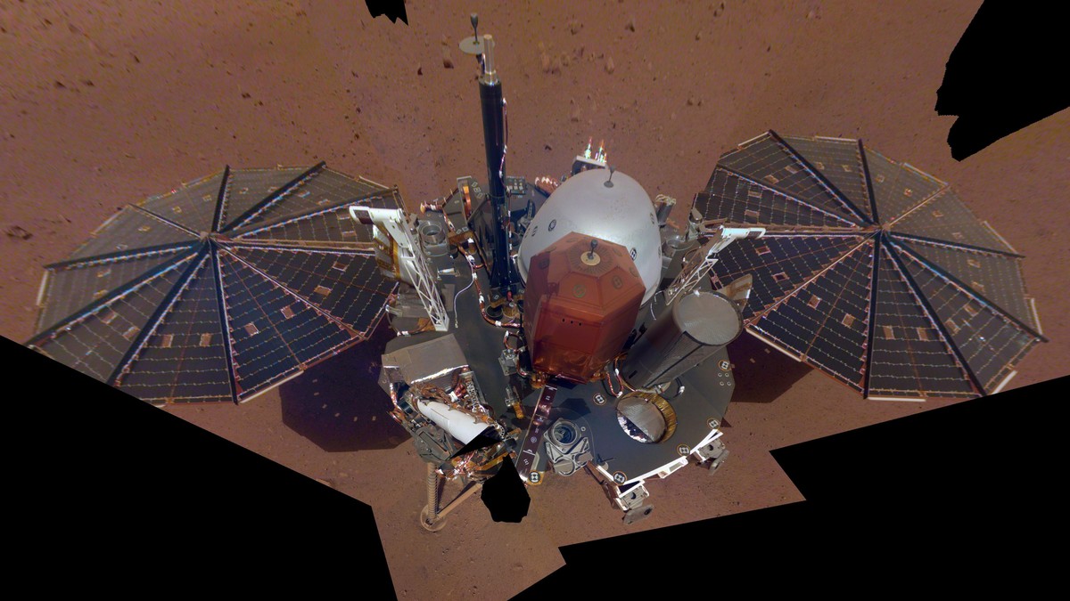 FILE - This Dec. 6, 2018 image made available by NASA shows the InSight lander. The scene was assembled from 11 photos taken using its robotic arm. The spacecraft is losing power because of all the du ...