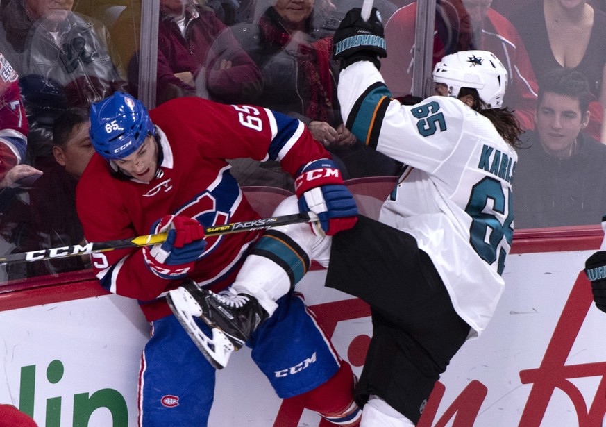 Montreal Canadiens&#039; Andrew Shaw avoids San Jose Sharks&#039; Erik Karlsson during third period NHL hockey action in Montreal on Sunday, Dec. 2, 2018. (Paul Chiasson/The Canadian Press via AP)