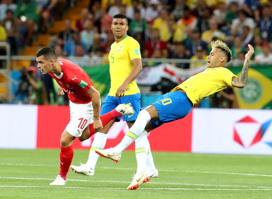 epa06816773 Neymar of Brazil (R) and Granit Xhaka of Switzerland (L) in action during the FIFA World Cup 2018 group E preliminary round soccer match between Brazil and Switzerland in Rostov-On-Don, Ru ...