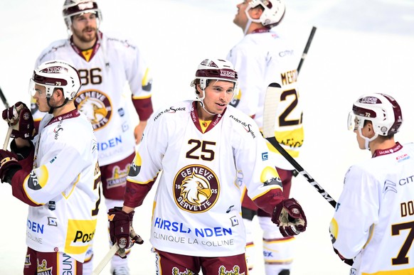 Geneve-Servette&#039;s player Mike Wyniger, center, reacts during the preliminary round game of National League Swiss Championship between HC Lugano and Geneve-Servette HC, at the ice stadium Resega i ...