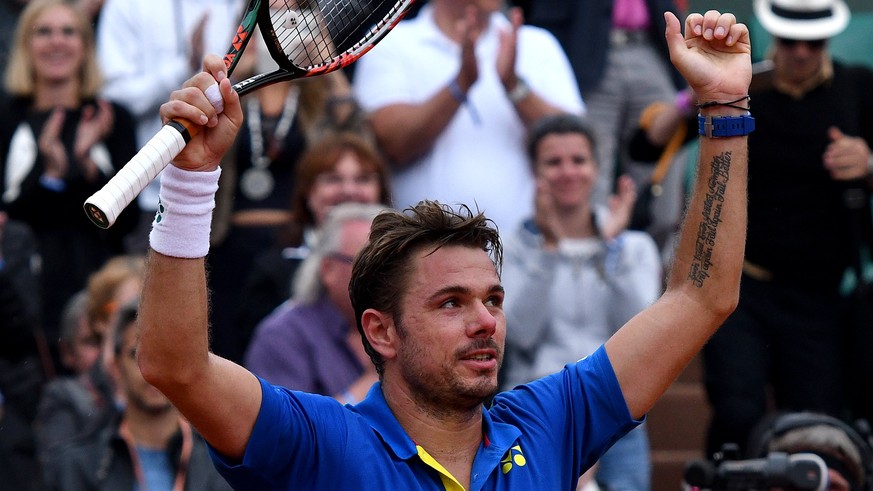 epa06008147 Stanislas Wawrinka of Switzerland reacts after winning against Fabio Fognini of Italy during their men’s singles 3rd round match during the French Open tennis tournament at Roland Garros i ...