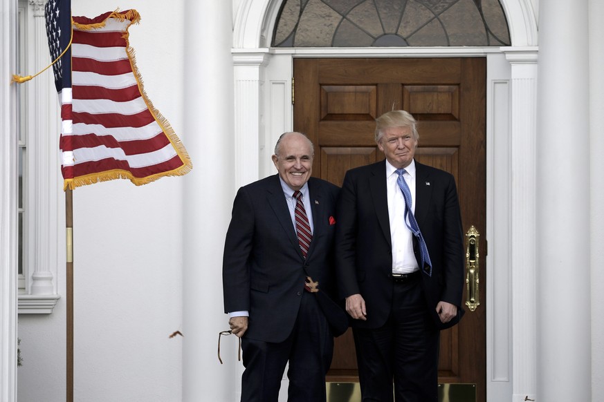 epa05640223 Former New York City Mayor Rudy Giuliani (L) poses with US President-elect Donald Trump at the clubhouse of Trump International Golf Club, in Bedminster Township, New Jersey, USA, 20 Novem ...