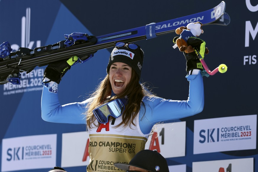 Italy&#039;s Marta Bassino celebrates on the podium after winning an alpine ski, women&#039;s World Championships super G, in Meribel, France, Wednesday, Feb. 8, 2023. (AP Photo/Alessandro Trovati)