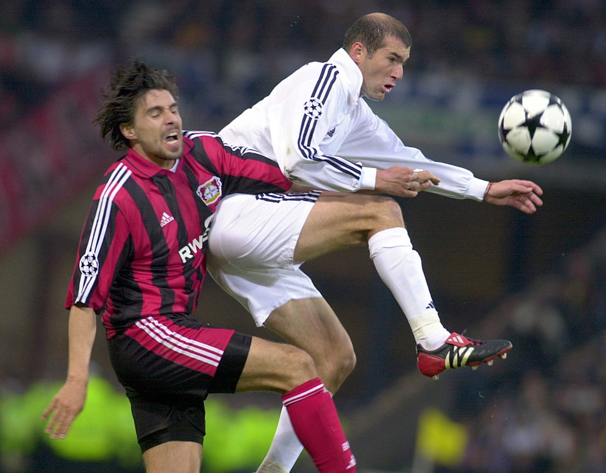 Real Madrid's Zinedine Zidane, right, is challenged by Bayer Levekusen's Zoltan Sebescen during the UEFA Champions League final at Hampden Park in Glasgow, Scotland Wednesday May 15, 2002. ( ...
