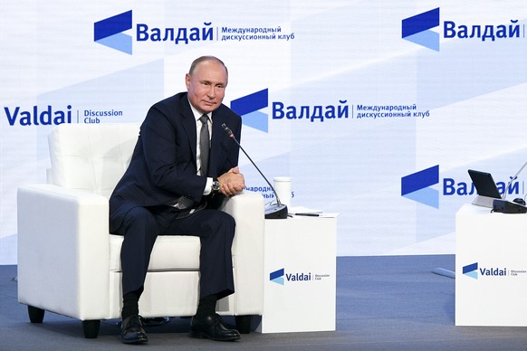 Russian President Vladimir Putin gestures attends the annual meeting of the Valdai Discussion Club in the Black Sea resort of Sochi, Russia, Thursday, Oct. 21, 2021. President Vladimir Putin has voice ...