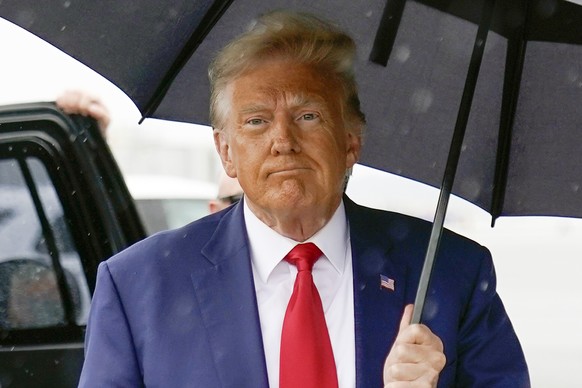 FILE - Former President Donald Trump walks to speak with reporters before boarding his plane at Ronald Reagan Washington National Airport, Aug. 3, 2023, in Arlington, Va. The federal judge overseeing  ...