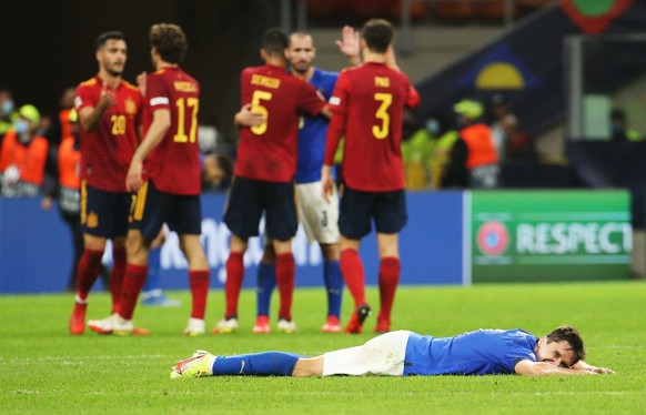 epaselect epa09509950 Federico Chiesa of Italy lies on the pitch after Spain won the UEFA Nations League semi final soccer match between Italy and Spain in Milan, Italy, 06 October 2021. EPA/MATTEO BA ...