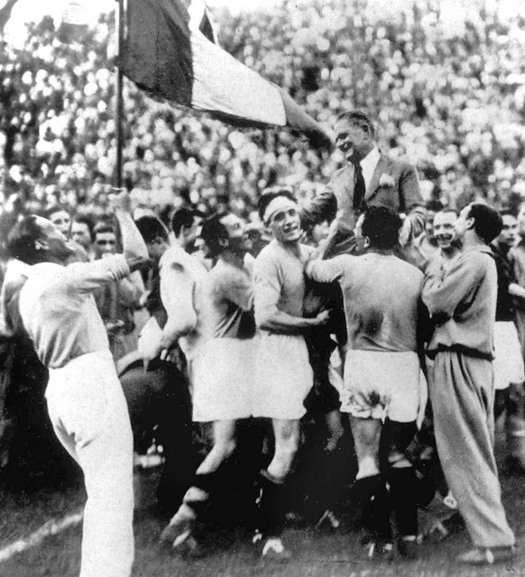 Italian coach Vittorio Pozzo is carried in triumph after Italy defeated Czechoslovakia 2-1, after extra time in the World Cup Final, to win the Rimet Cup, June 10, 1934, at the Fascist National Party  ...