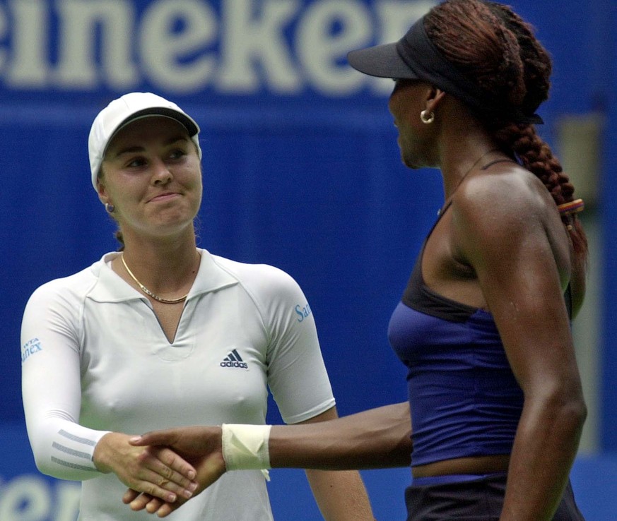 Switzerland&#039;s Martina Hingis, right, shakes hands with American Venus Williams following their semi-final match at the Australian Open tennis championship in Melbourne, Australia, Thursday, Jan.  ...