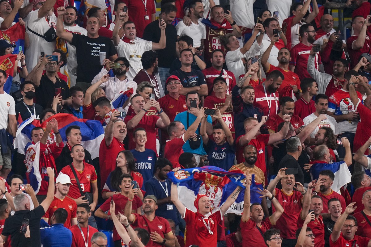 Serbia's supporters cheer from the stands prior the start the World Cup group G soccer match between Serbia and Switzerland, at the Stadium 974 in Doha, Qatar, Friday, Dec. 2, 2022. (AP Photo/Pet ...