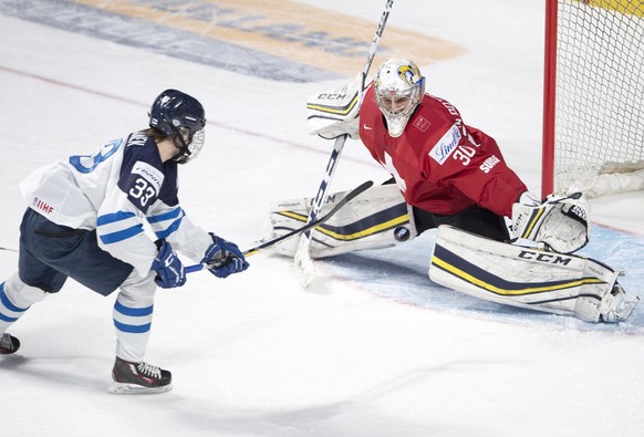 Switzerland goaltender Joren van Pottelberghe (30) makes the save on Finland&#039;s Eeli Tolvanen (33) during the second period of a IIHF World Junior Championships hockey game Saturday, Dec. 31, 2016 ...