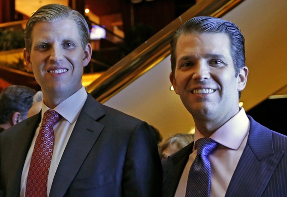 Eric Trump, left, and Donald Trump Jr., executive vice presidents of The Trump Organization, pose for a photograph at an event for Scion Hotels, a division of Trump hotels, Monday, June 5, 2017, in Ne ...