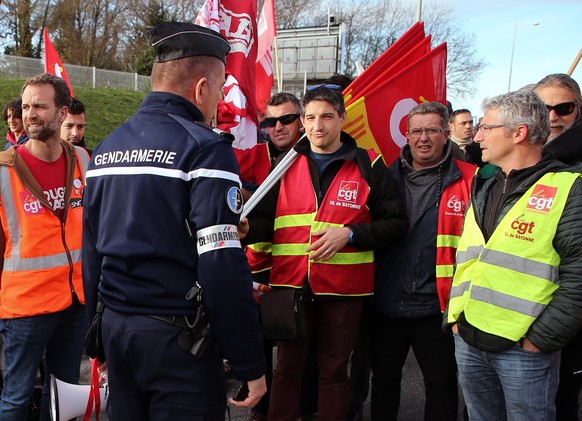 Trade union demonstrators are blocked by police officers in Biarritz, southwestern France, Tuesday, Dec.24, 2019. France&#039;s punishing transportation troubles may ease up slightly over Christmas, b ...