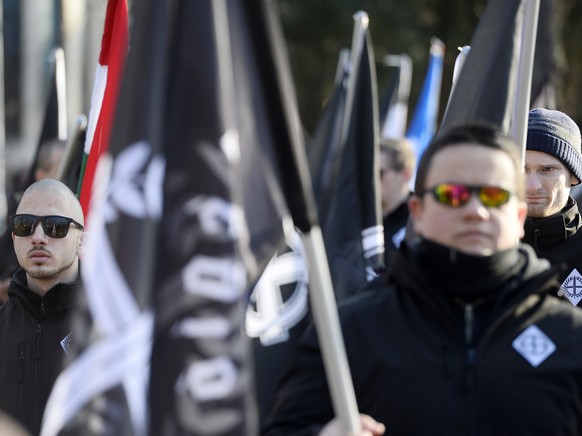 epa08203618 Following the call of two Hungarian extreme right organizations Legio Hungaria and Hungarian Hammerskins, some 500 Hungarian and foreign, among them German, demonstrators march in a park t ...